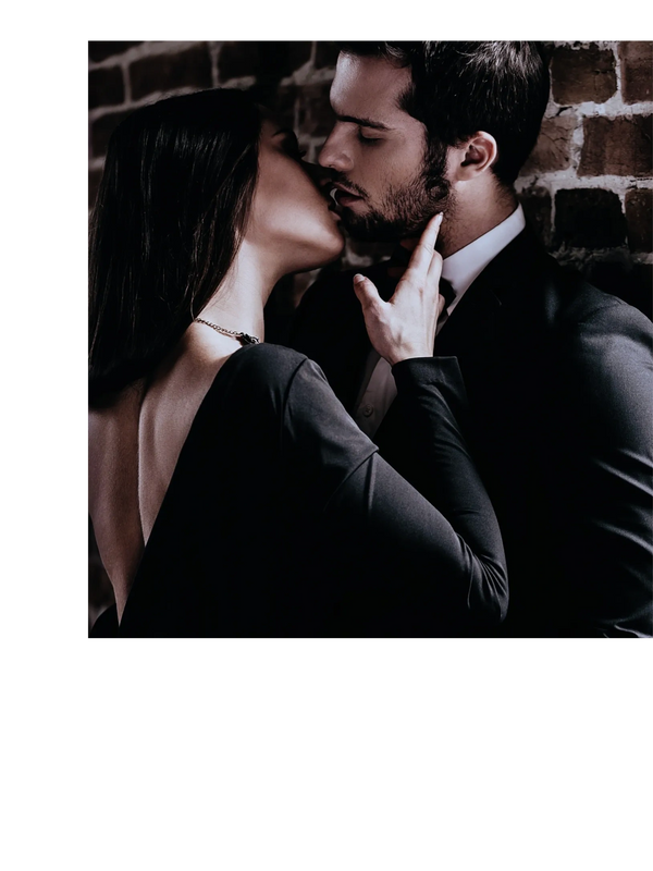 Two adults in formal wear in a sensual embrace