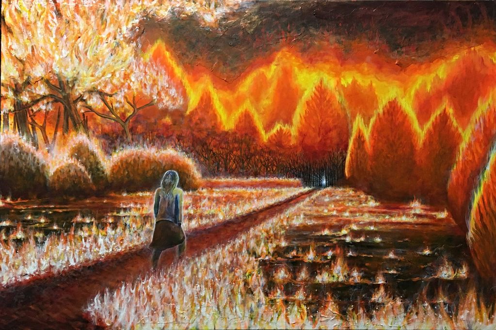 figure in blue walking path through forest fire field fire