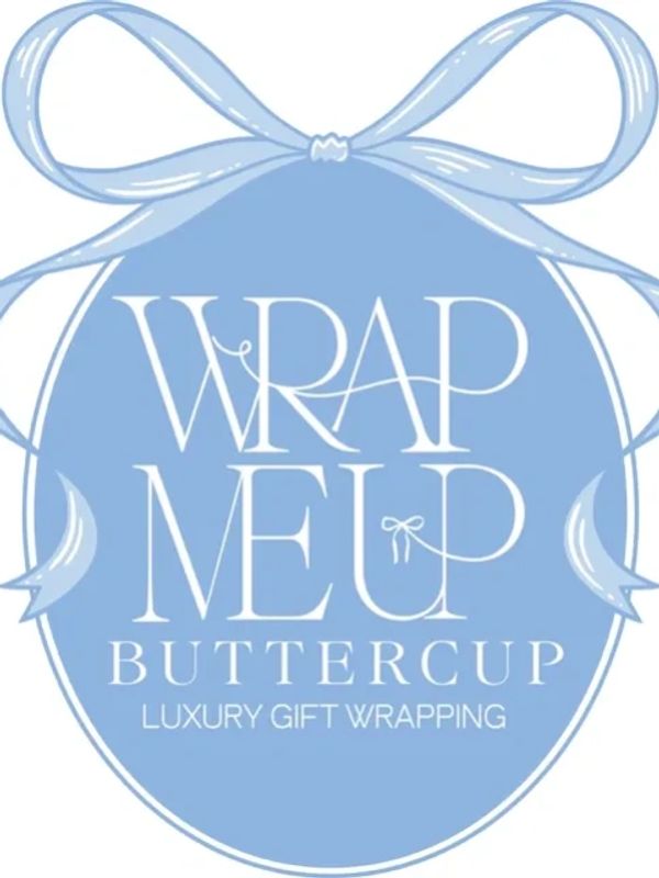 Elegant blue logo with a ribbon and the text 'Wrap Me Up Buttercup Luxury Gift Wrapping'.