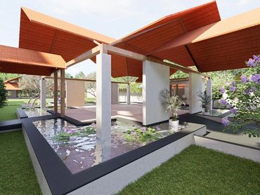 Outdoor pavilion with dramatic angled terracotta roof, open-air columns, and manicured lawn