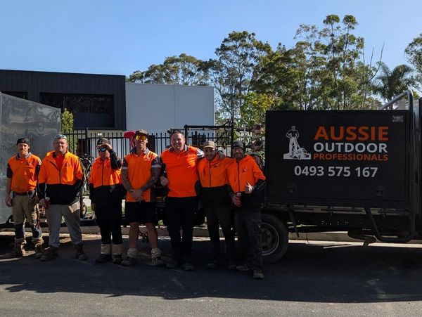 the Aussie Outdoor Professional Team in front of their lawn mowing truck in Nowra
