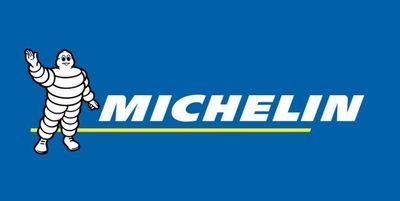 Michelin logo with Bibendum mascot waving on blue background.