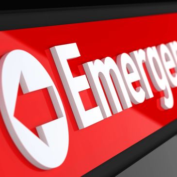 Image of an emergency sign with an arrow pointing to location