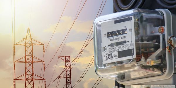 Image of electricity meter and electric towers