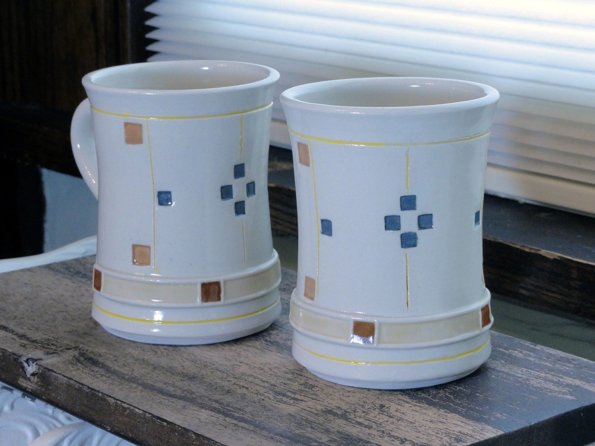 Two Prairie Olive mugs in porcelain. 8 ounces each. Dishwasher and microwave safe. Arts and crafts