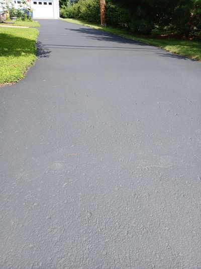 Cured sealcoating at on residential driveway in Northfield, MN