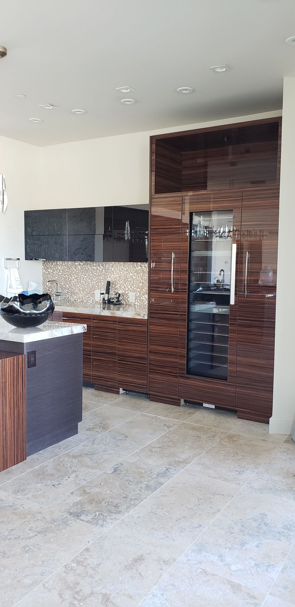 High gloss finish Zebra wood this kitchen is essence of modern design.