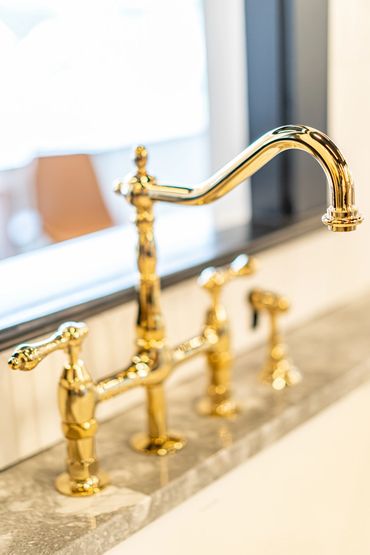 shiny gold bathroom faucet