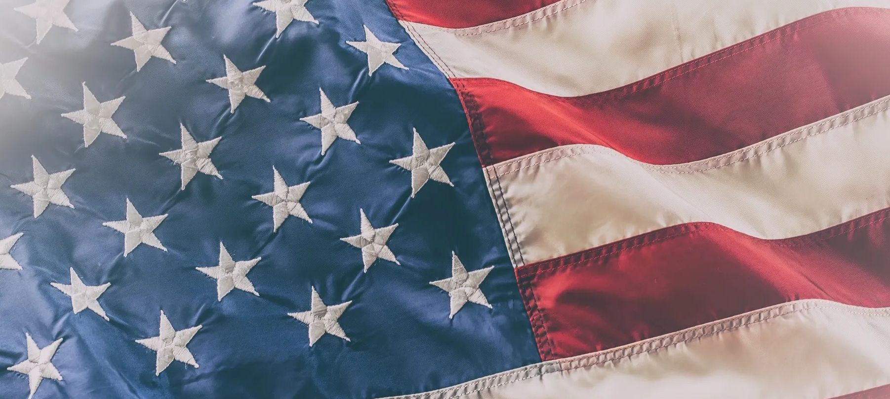 Close-up of the American flag's stars and stripes.