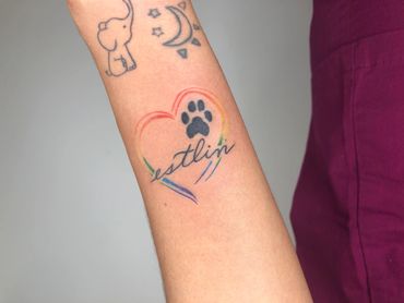 Custom LGBTQ heart and dog print tattoo done by by The best black and grey tattoo artist Kevin Lizar