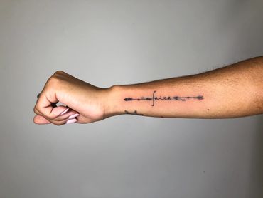 The best black fine line script tattoo