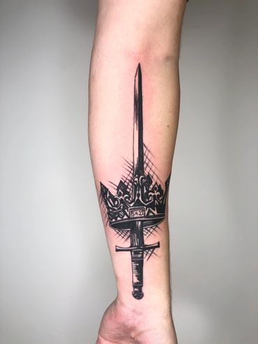 The best black and grey tattoo of a sword done by Kevin Lizarraga top rated tattoo artist