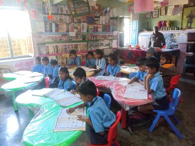 children sitting in a classroom