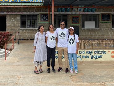 Founders standing in front of high school in India