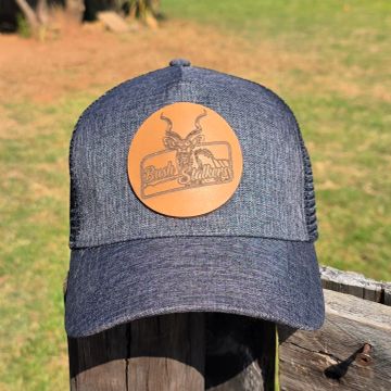 Gray baseball cap with a leather patch logo.