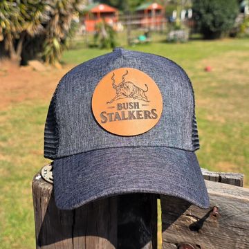 Gray cap with 'Bush Stalkers' patch and animal graphic.
