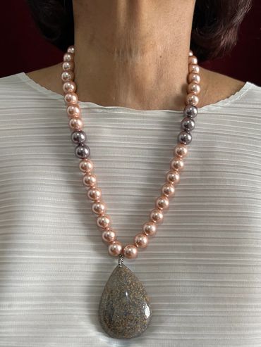 Handmade necklace with purple and light pink tone Shell Pearls and teardrop Fossil Coral Pendant.