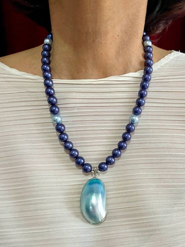 Handmade necklace with Shell Pearls and Shell Pendant.