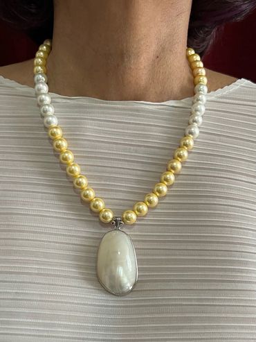 Handmade necklace with yellow/white tone Shell Pearls and white Pearl Pendant.
