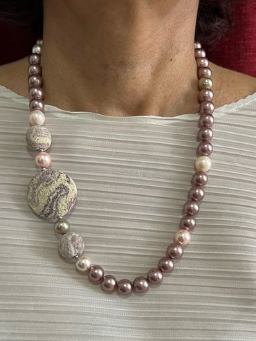 Handmade necklace with Maude tone Shell Pearls and flat round Lava.