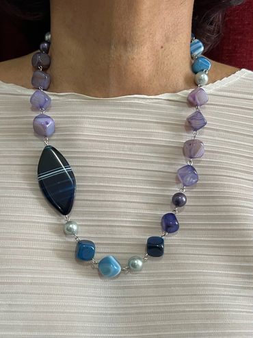 Handmade necklace with purple/blue tone Shell Pearls and stripped Agate.