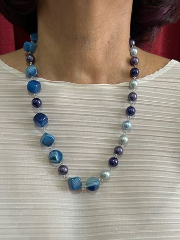 Handmade necklace with purple/blue tone Shell Pearls and diagonal cube blue stripped Agate.