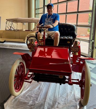 Barton Close sitting in the Marr Auto Car at the 2025 BCA National.