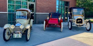 Buick Cycle Car, Marr Auto Car, and Buick 1909 Model 10 left to right.