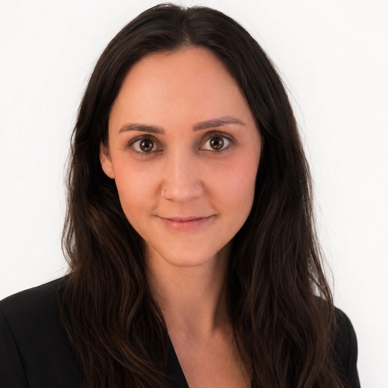 Portrait of a woman with dark hair and brown eyes.