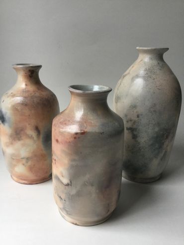 Trio of barrel fired vases- 5-7 inches 