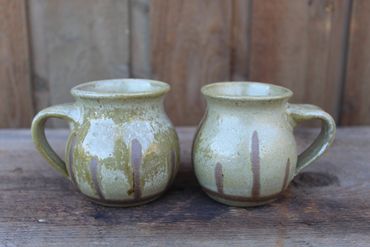 Pair of wax resist mugs with pine wood ash