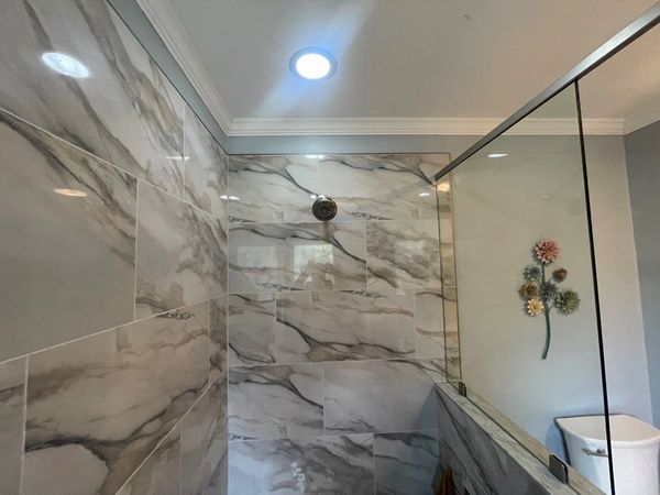 A marble shower remodel in NC done by ChilMor Roofing & Construction in Winston Salem