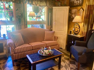 American made living room furniture with a couch and a chimney cabinet.