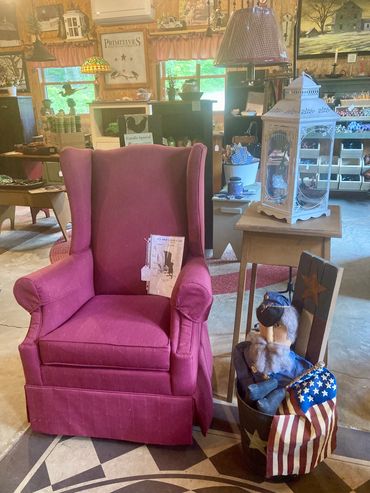 American made upholstered chair with Americana decorations.