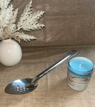 spoon/ladle with holes used for cajun cooking sold by Leroys Cajun Cookware LLC