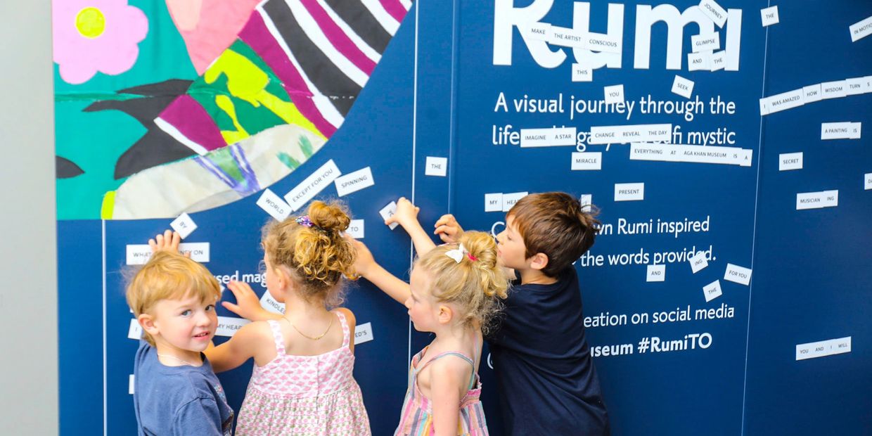 Children participating in an interactive activity at the Rumi Exhibit.