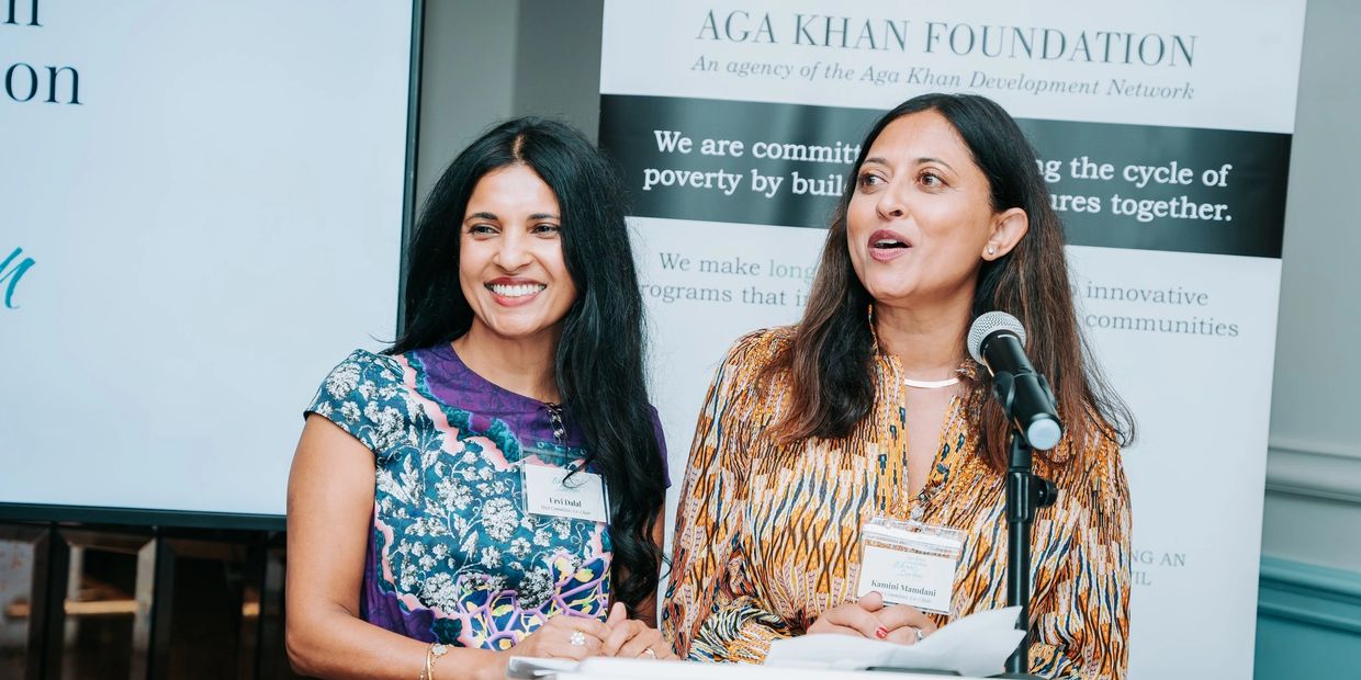 Two women speaking at the inaugural Women's luncheon.