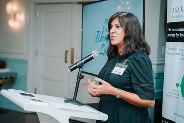A woman speaking at the Women's Luncheon.