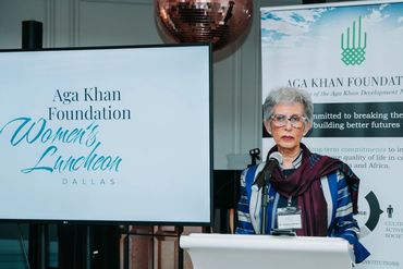 A woman speaking at the Women's Luncheon.