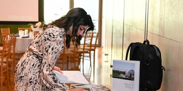 A woman checking in to the Aga Khan Museum lunch.