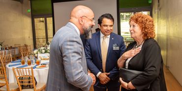 3 people talking at the Aga Khan Museum lunch.