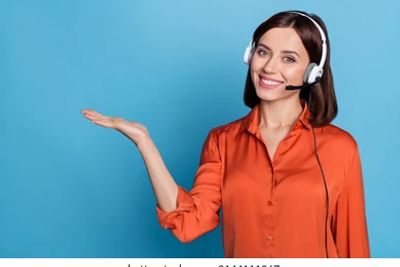 Smiling woman with headset presenting something.