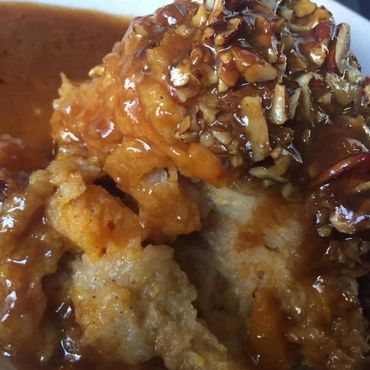 Crispy fried chicken with pecan praline topping and rich brown sauce.