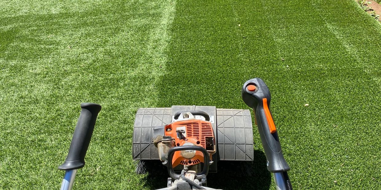 Lawn mower cutting fresh green grass.