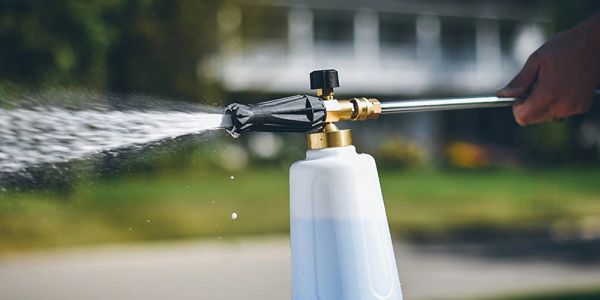 Foam cannon spraying cleaning solution.