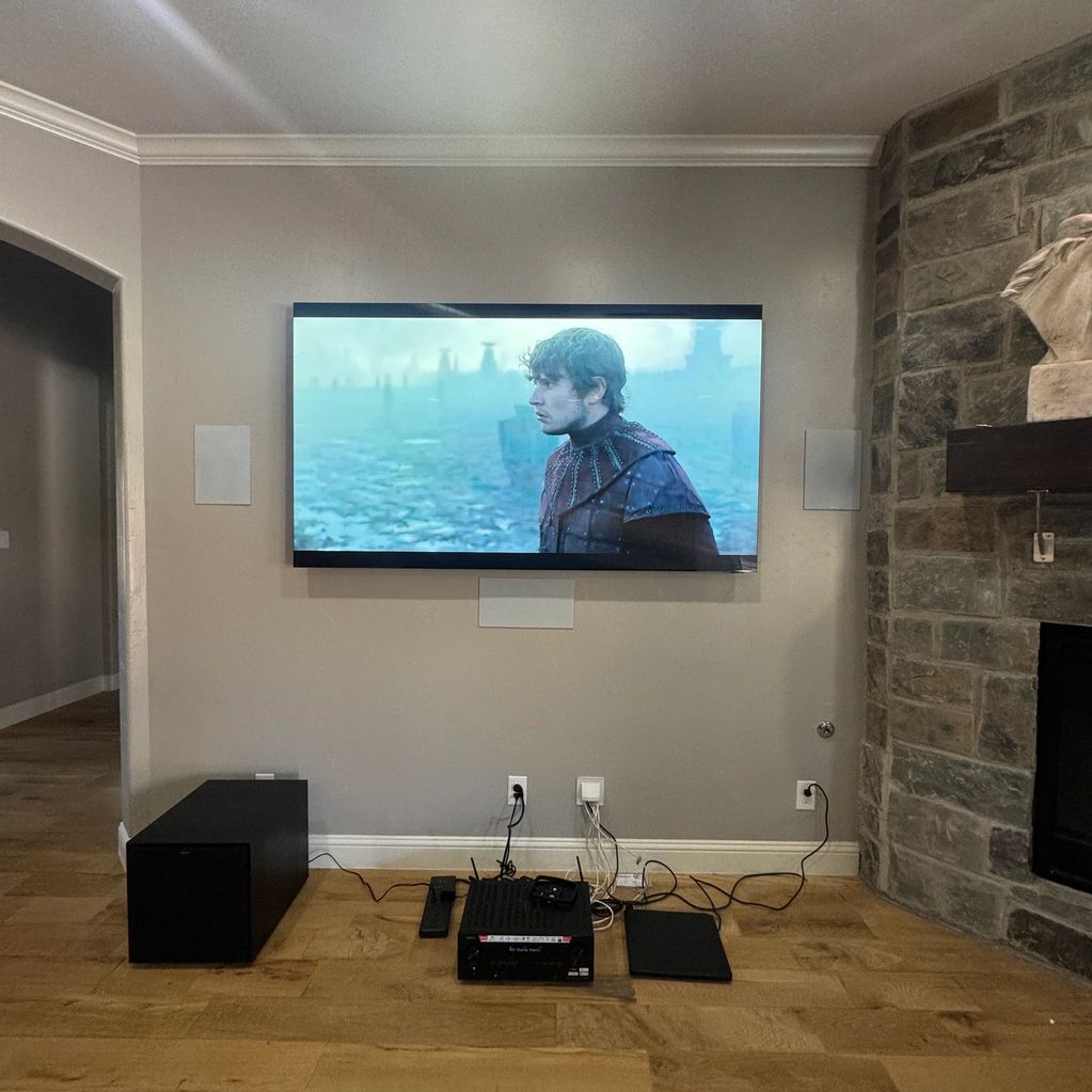 85 Inch Samsung Tv Mounted with a 5.1 Surround Sound.