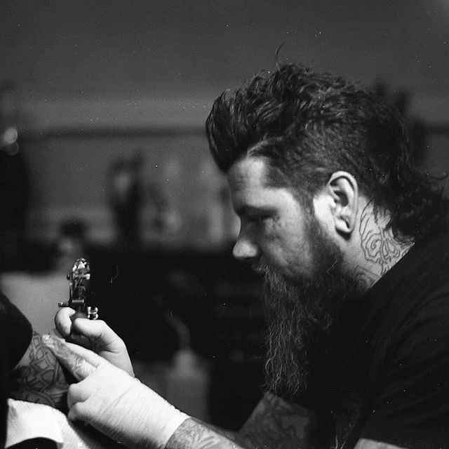 creepy jason tattooing a tattoo while having tattoos 