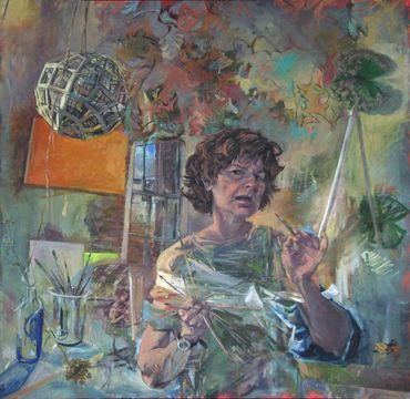 Woman in a sling painting inside her studio. The space is ambiguous.