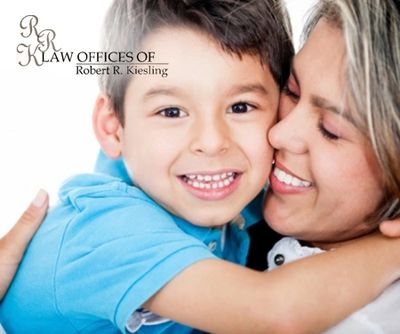 A woman hugging a child