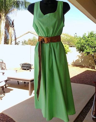 A long dress on a mannequin in green color wore by an idol
